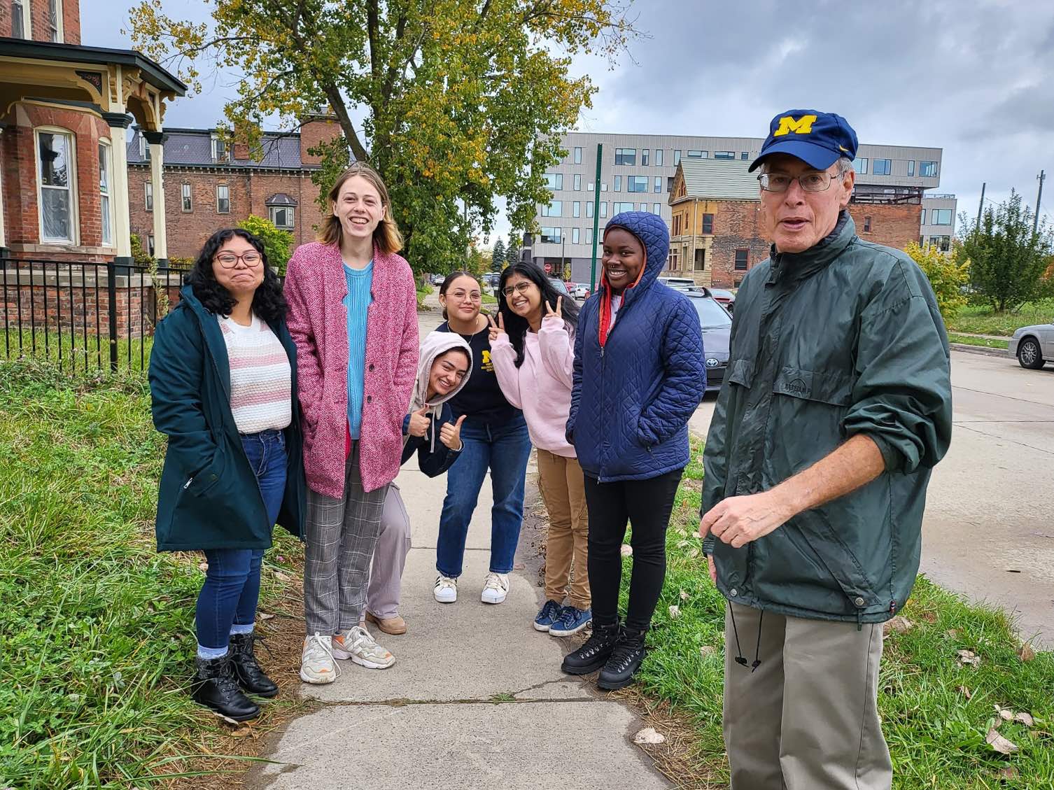 UM-Dearborn students gather for a photo in a Detroit neighborhood