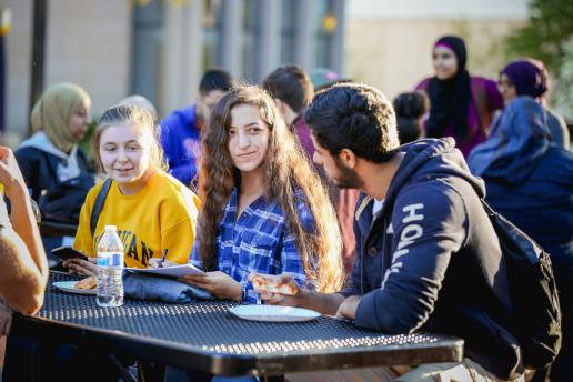 University of Michigan-Dearborn students eating lunch outdoors on campus