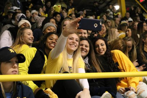 Fans at hockey game take selfie
