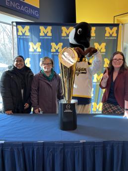 CASL Advising Staff pictured with the national championship trophy