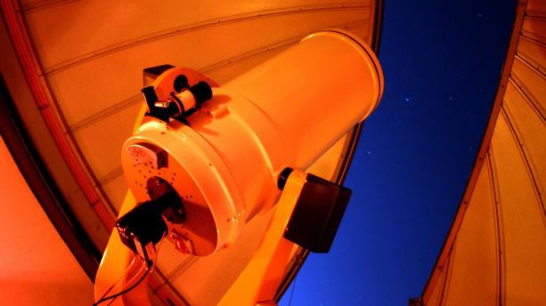Telescope looking into the night sky