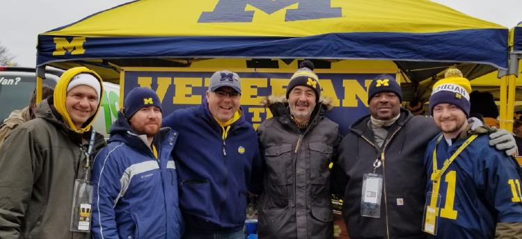 Chancellor Grasso joins Veterans prior to Michigan football game.