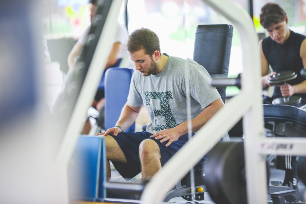 Student working out at the wellness center