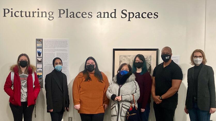 Professor Susan Erickson, far right, and the students in her Art History Capstone course helped create the newest Stamelos Gallery Center exhibit, "Picturing Places and Spaces."