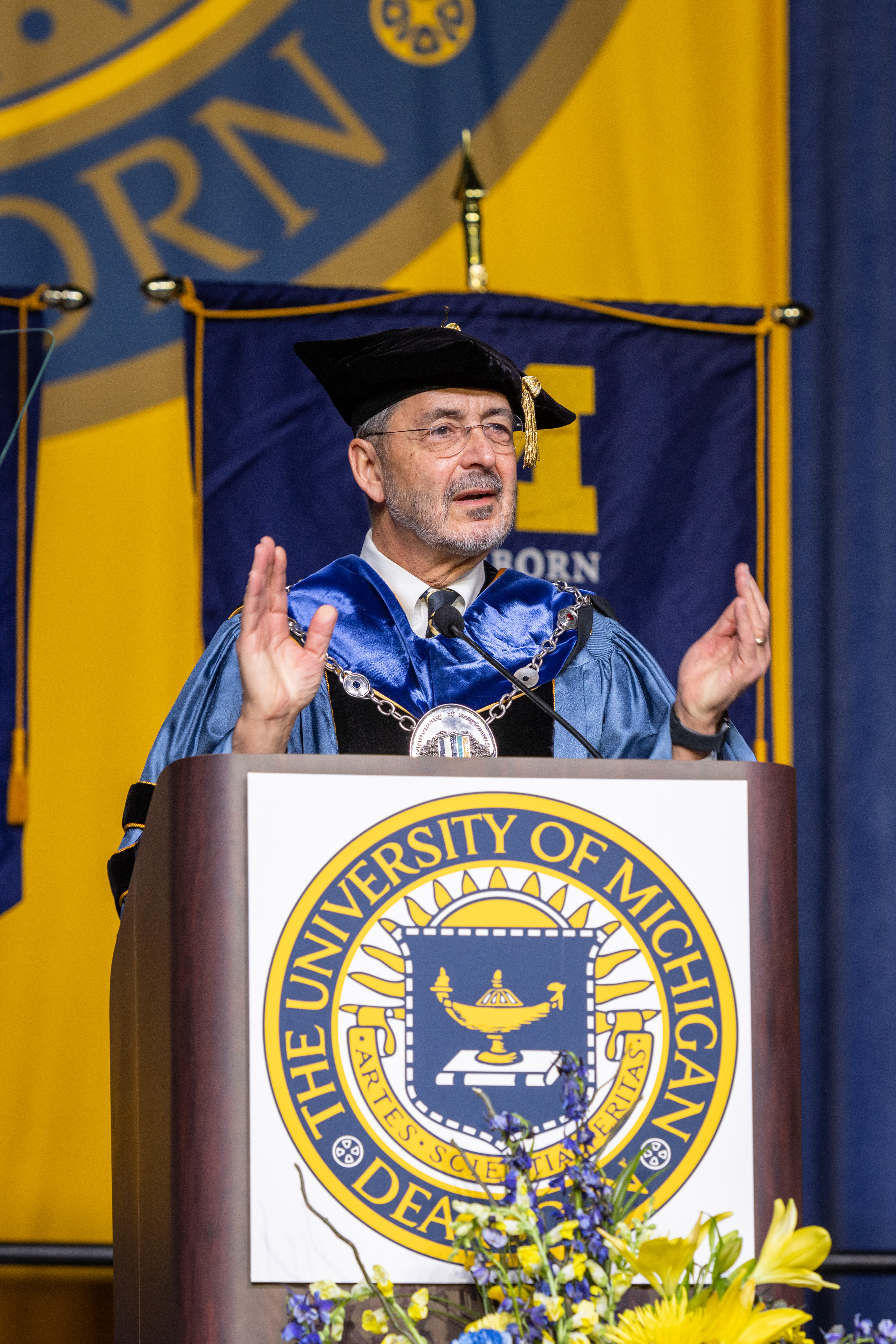 Photo of Chancellor Domenico Grasso speaking to graduates
