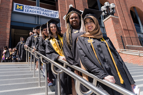 Graduates standing in line for Commencement