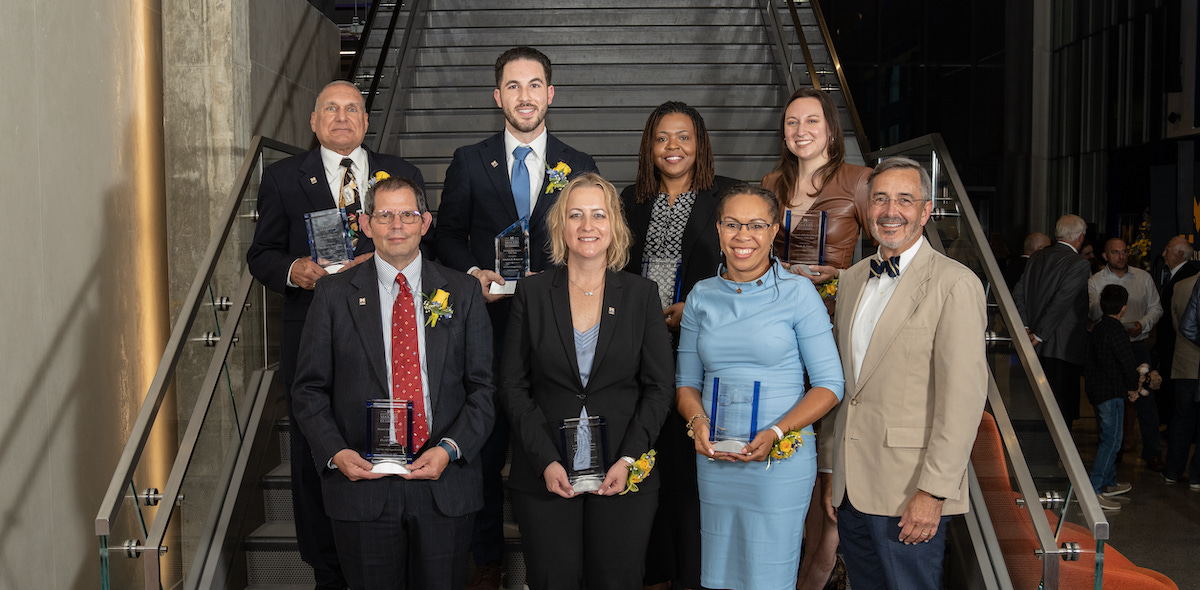 Chancellor Domenico Grasso, far right, presented awards to, top from left, Michael Surmanian, Mayor Abdullah Hammoud, Jackie Hart from Altair Engineering, and Nicole Corso; bottom row from left, David Yesh, Monika Minarcin and Robin Wilson.