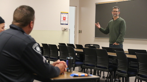  CASL faculty Paul Draus speaks to a group of officers during the Alternatives to Violent Force training on campus. 