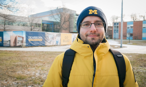  Mechanical engineering doctoral student Ruslan Akhmedagaev in his maize and blue winter gear outside the new Engineering Lab Building. 