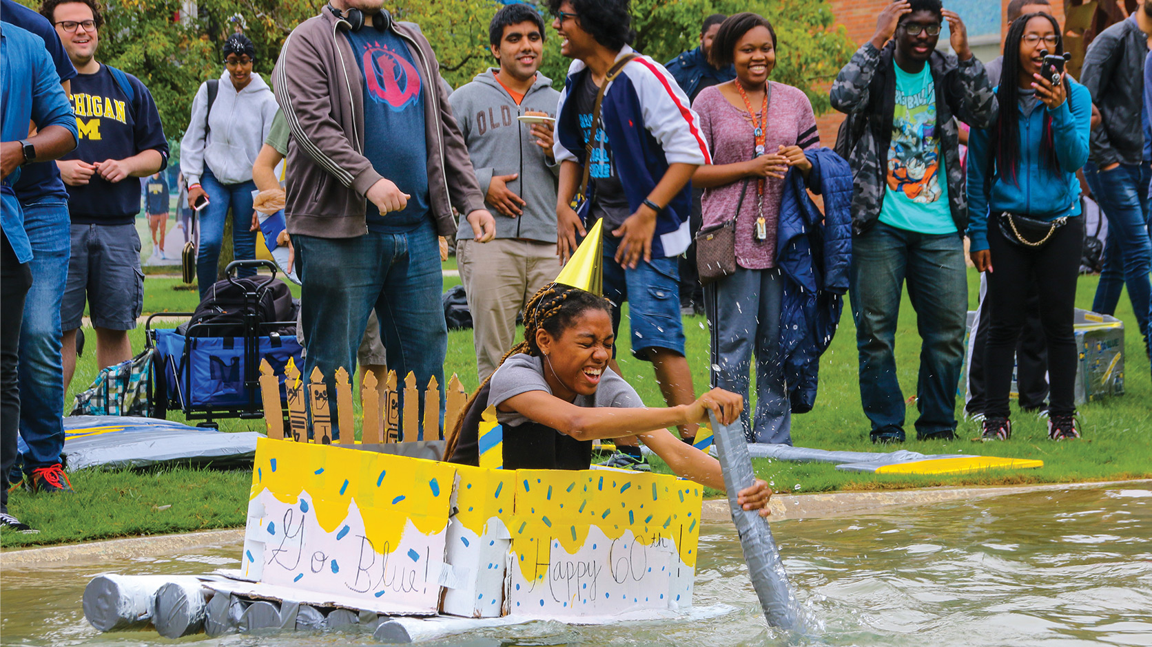 Photo of student doing the cardboard boat race