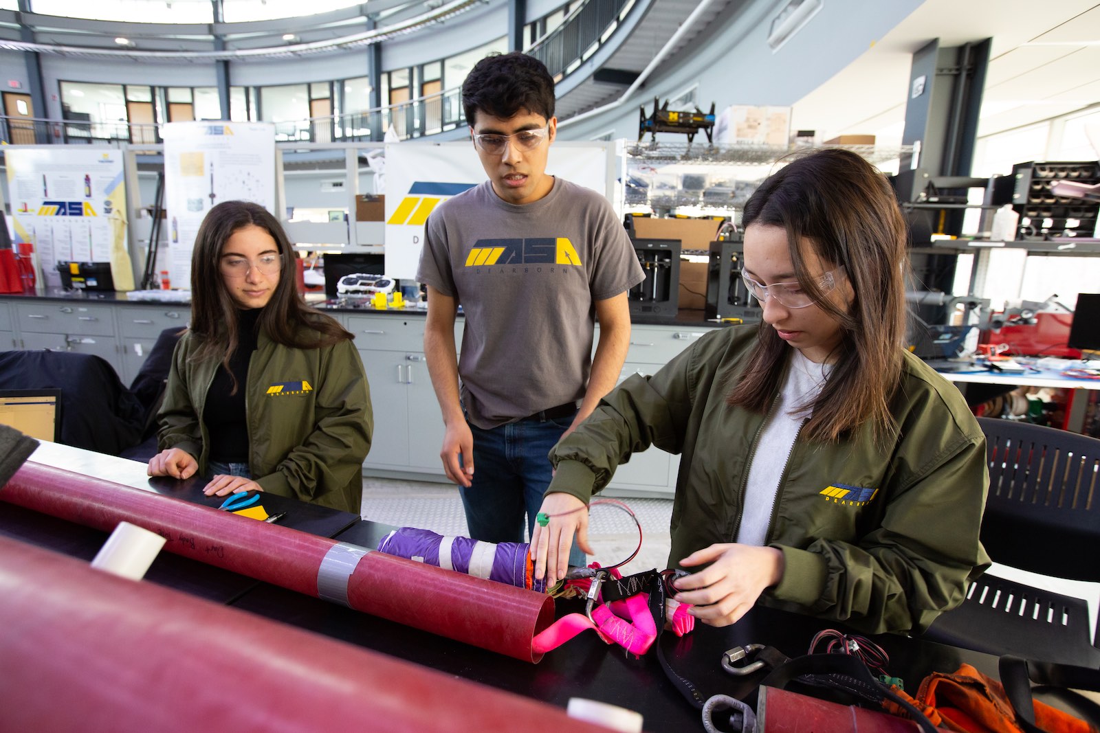 Photos of MASA students working on a rocket in the IAVS