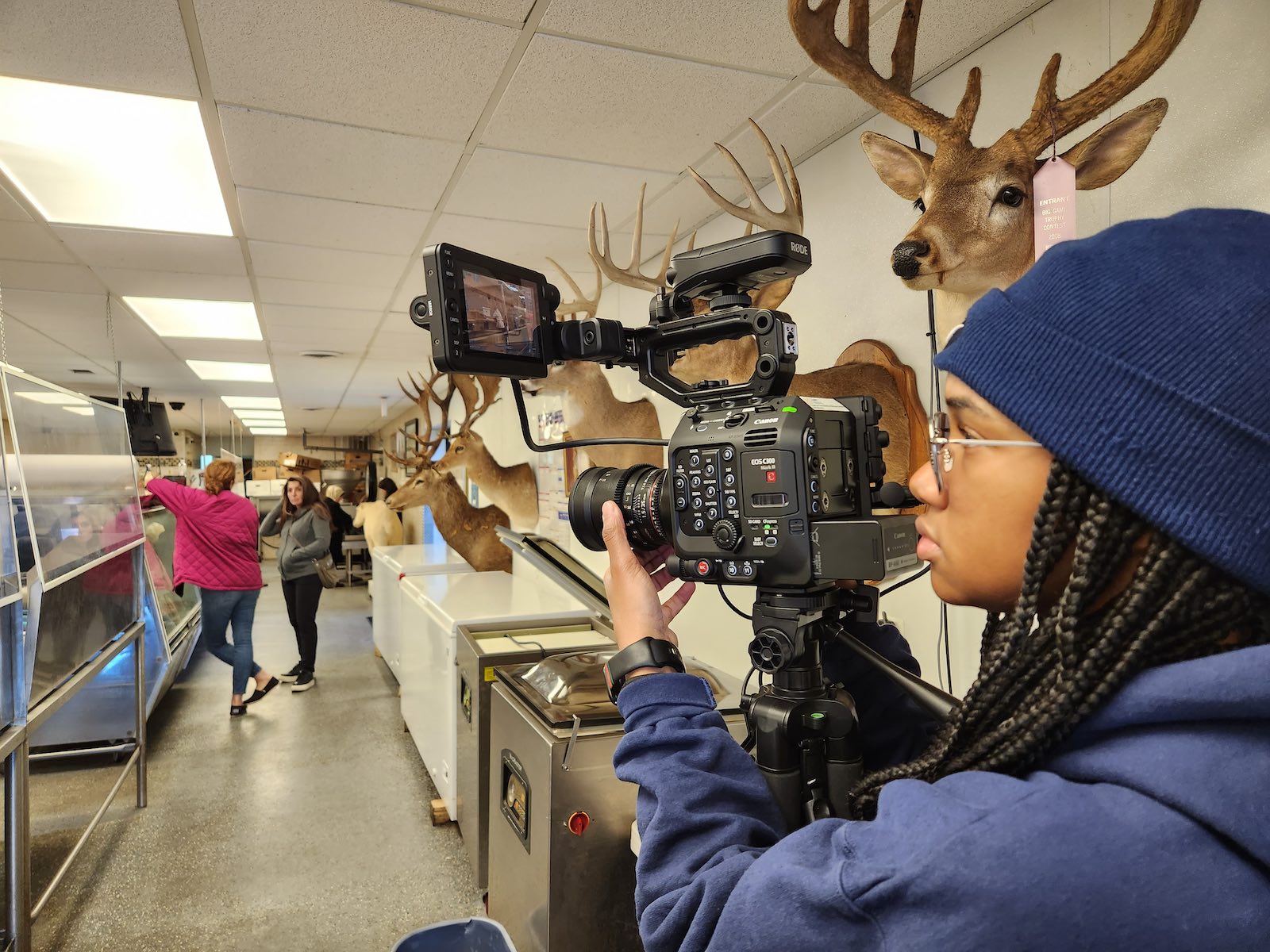 A JuMP UM-Dearborn student films a short documentary at Ronnie Berry's Halal butcher shop
