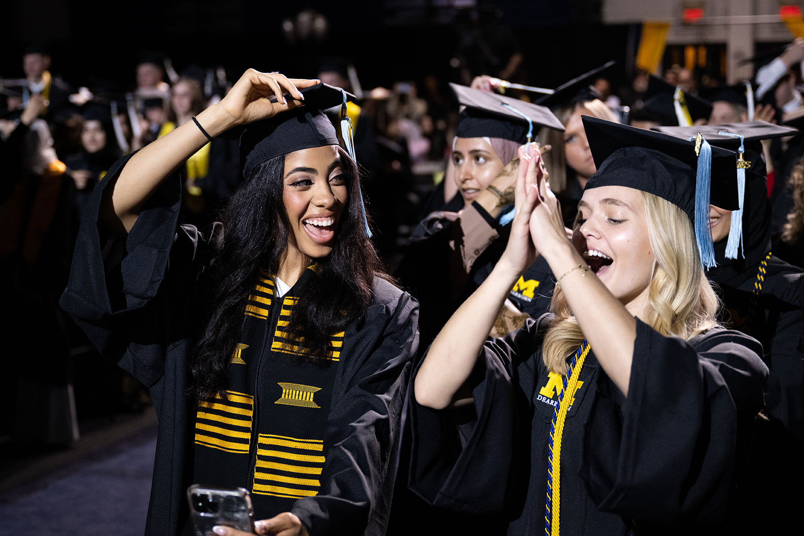 Graduates celebrating during commencement ceremony