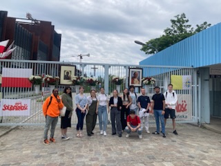 Students in front of the Polish Wall of Solidarity