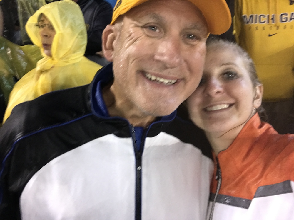 Erin Vestrand, right, and her father enjoying a past Michigan game.