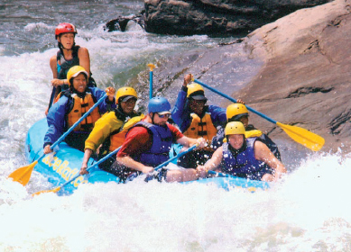 Alum Sheri Hunter whitewater rafting with friends