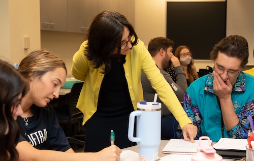Professor working with small group of students