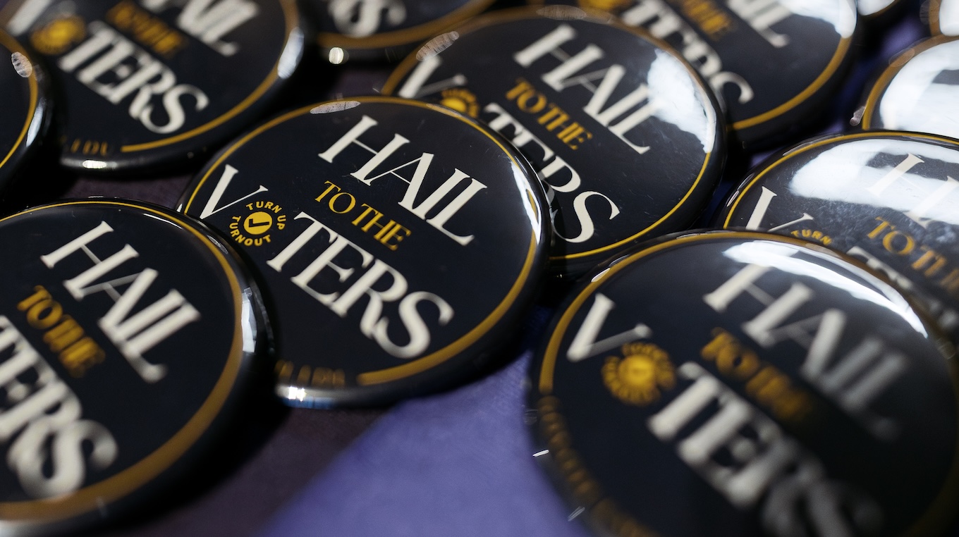 "Hail to the Victors" blue-colored buttons for people to wear