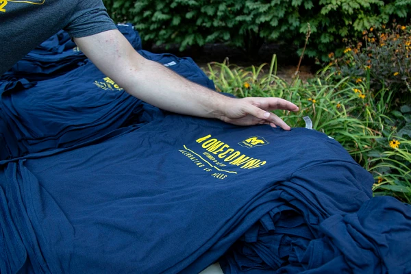 A student picks up a tshirt