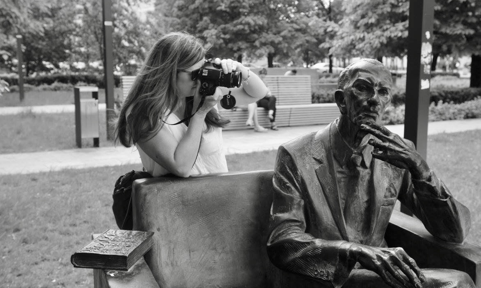 Beth Lundy taking a photo of a statute in Poland