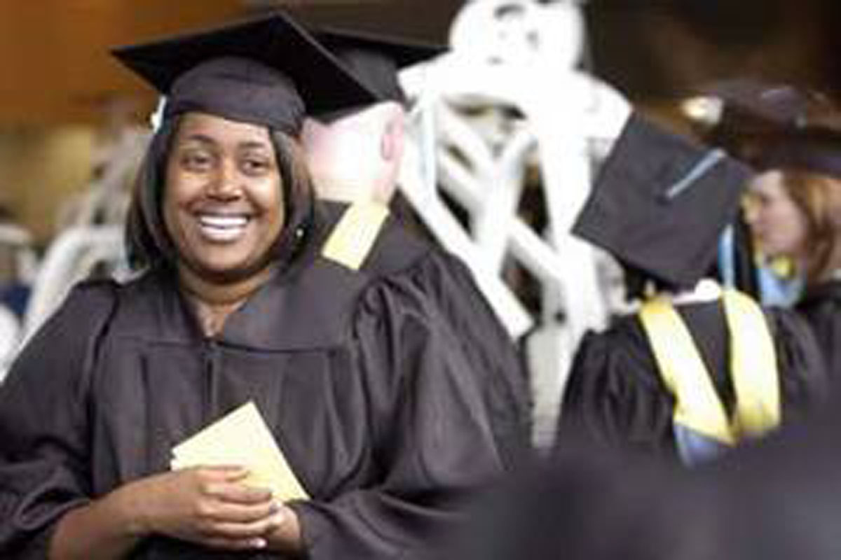 Smiling graduate at Commencement