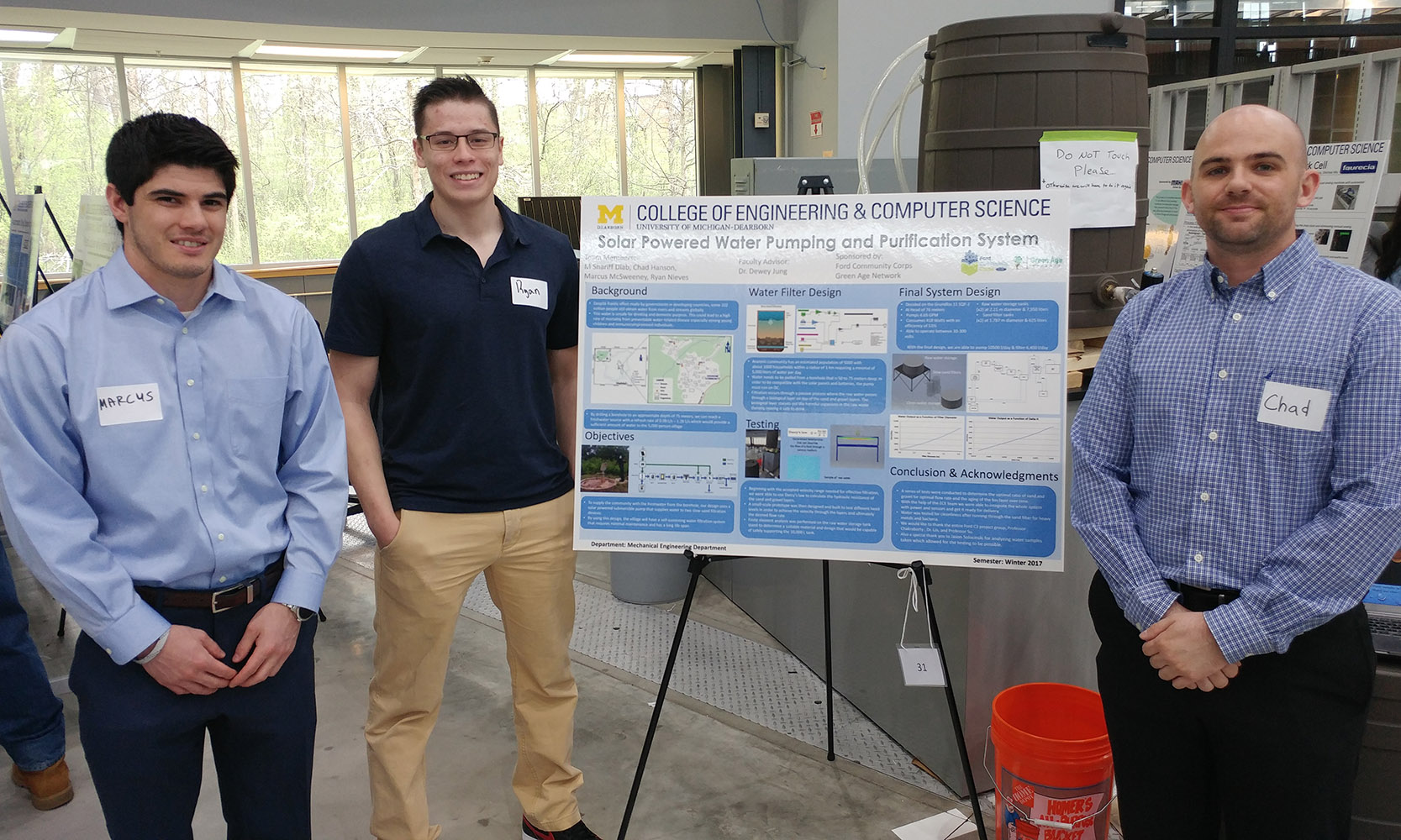 From left, Marcus McSweeney, Ryan Nieves and Chad Hanson received first place in the mechanical engineering department for their Senior Design Day project “Solar Powered Water Pumping and Purification System.” Group member M. Shariff Diab is not pictured.