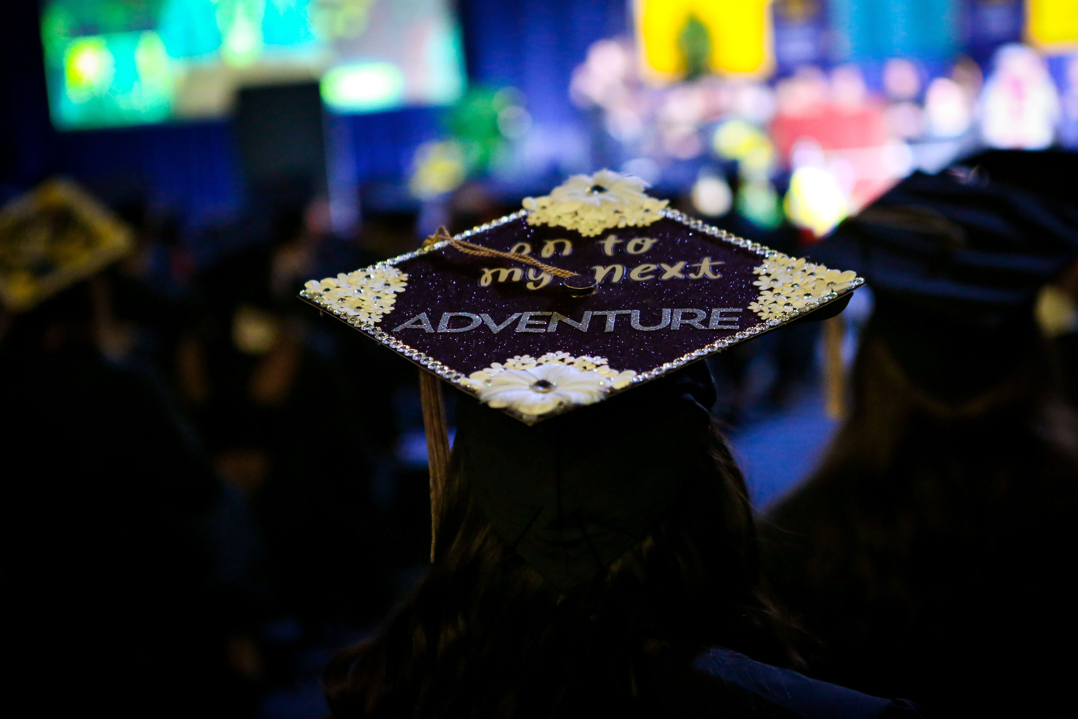 Graduation mortar board that says "On to the next adventure" 
