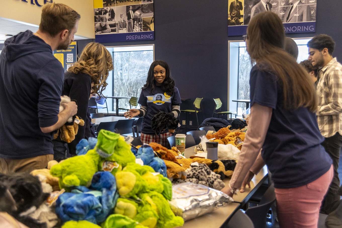 In this 2025 MLK Day of Service photo, students make stuffed animals at a long brown table in the Renick University Center.