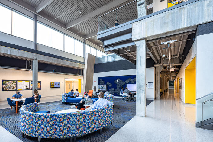 The old ELB didn't have a single informal gathering space for study groups or project teams to work or hang out. The new building is packed with moveable furniture and LED displays so teams can set-up, plug-in, and quickly share ideas. Credit: Jason Robinson Photography