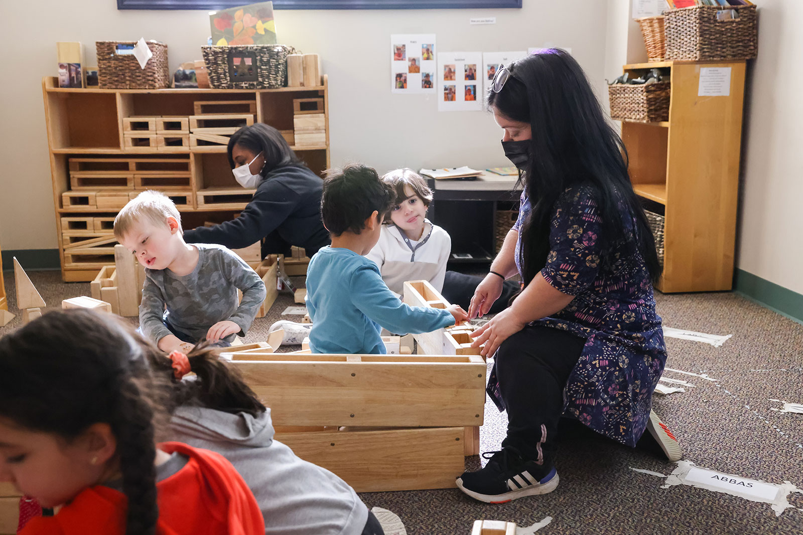 Teacher working with young children at the early childhood center