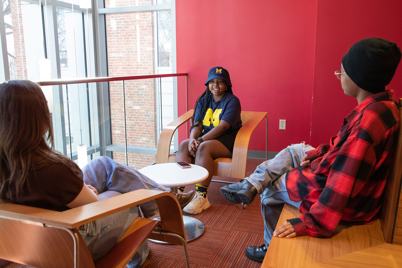 Students in a discussion in campus commons area