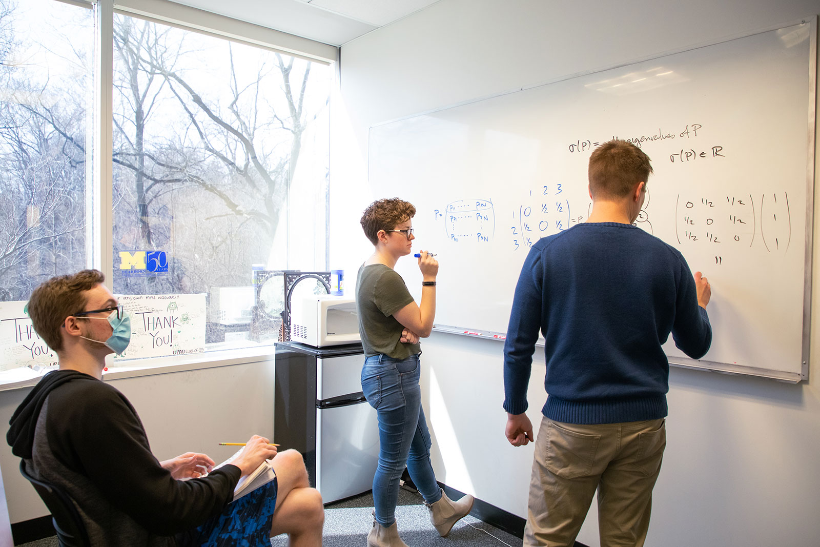 Students work on actuarial mathematics during office hours