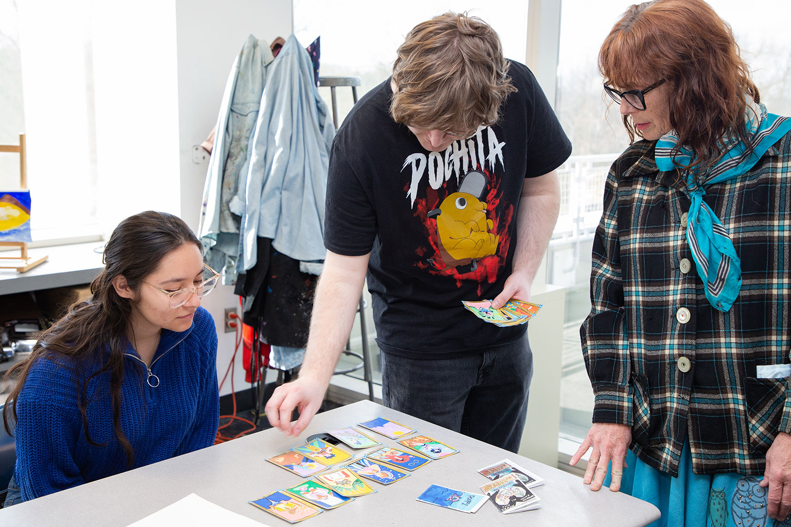 Students review artwork in art lab