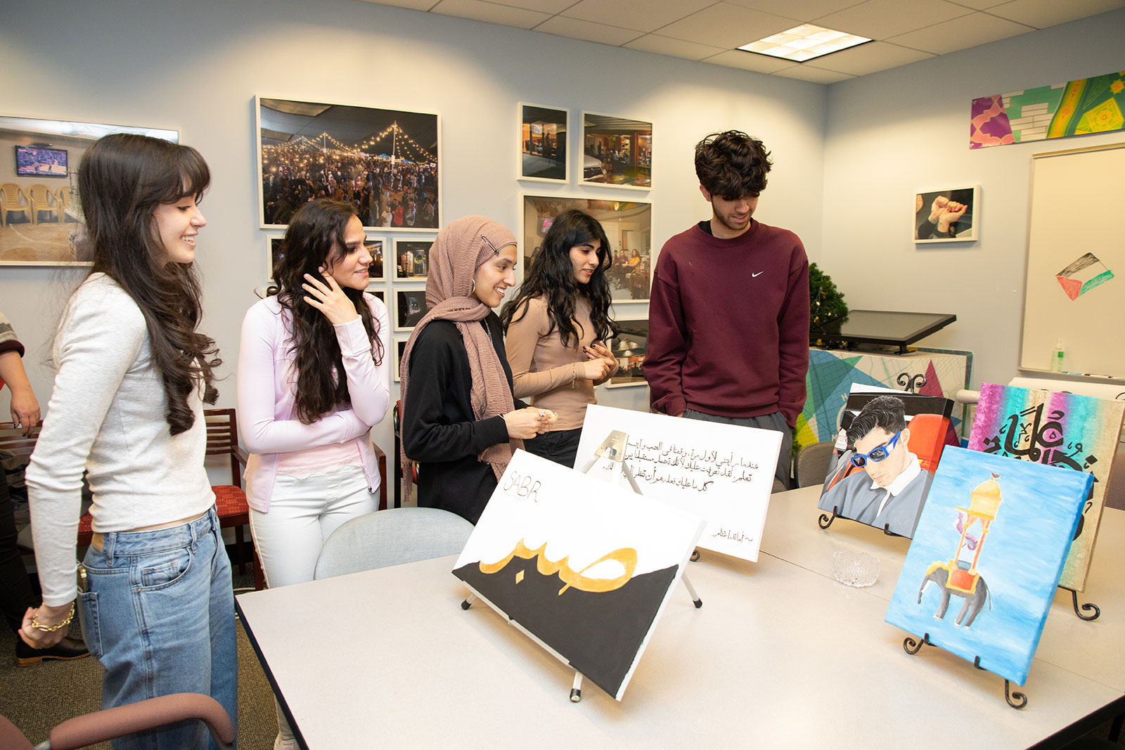 Students reviewing Arabic art