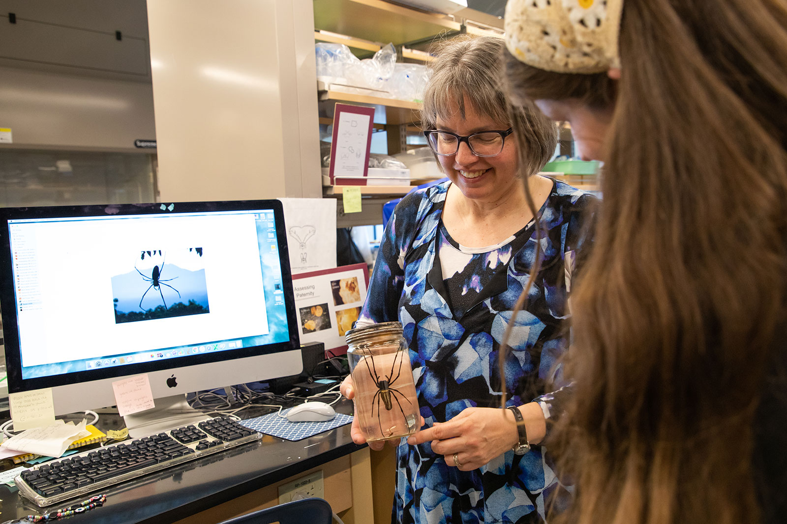 Student and professor review specimen in lab