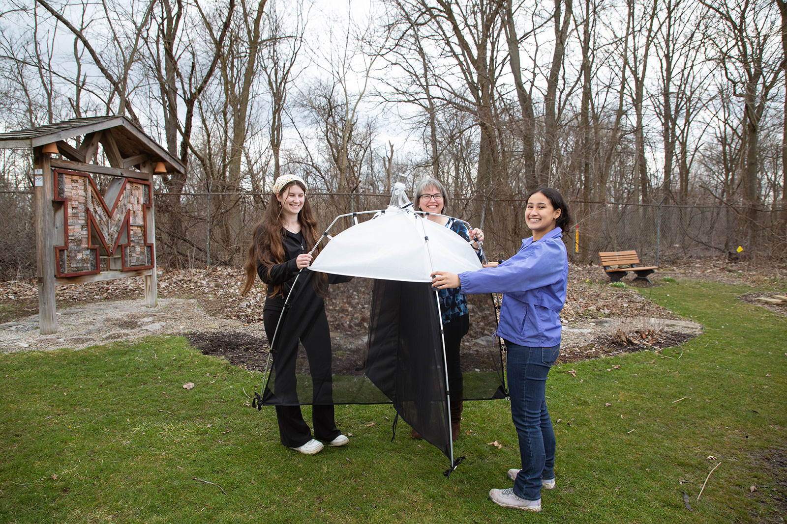 students outside participating in an experiment