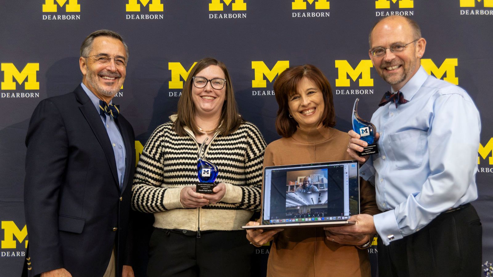 The external relations web team receiving their award from Chancellor Grasso for "Advancing the Mission"