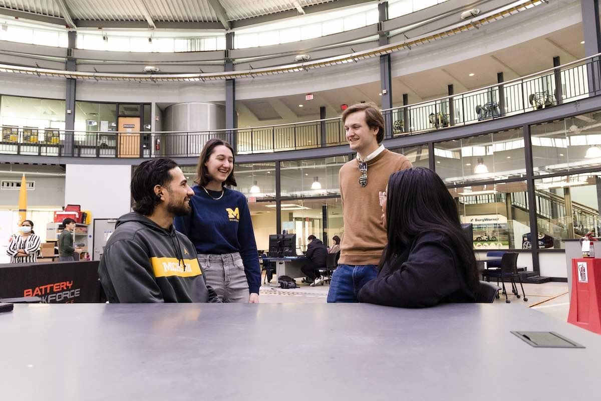 Students gather around a work table in the Institute for Advanced Vehicle Systems