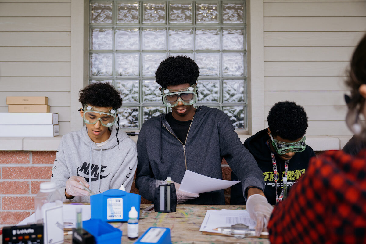 Students working outside in testing the environment.