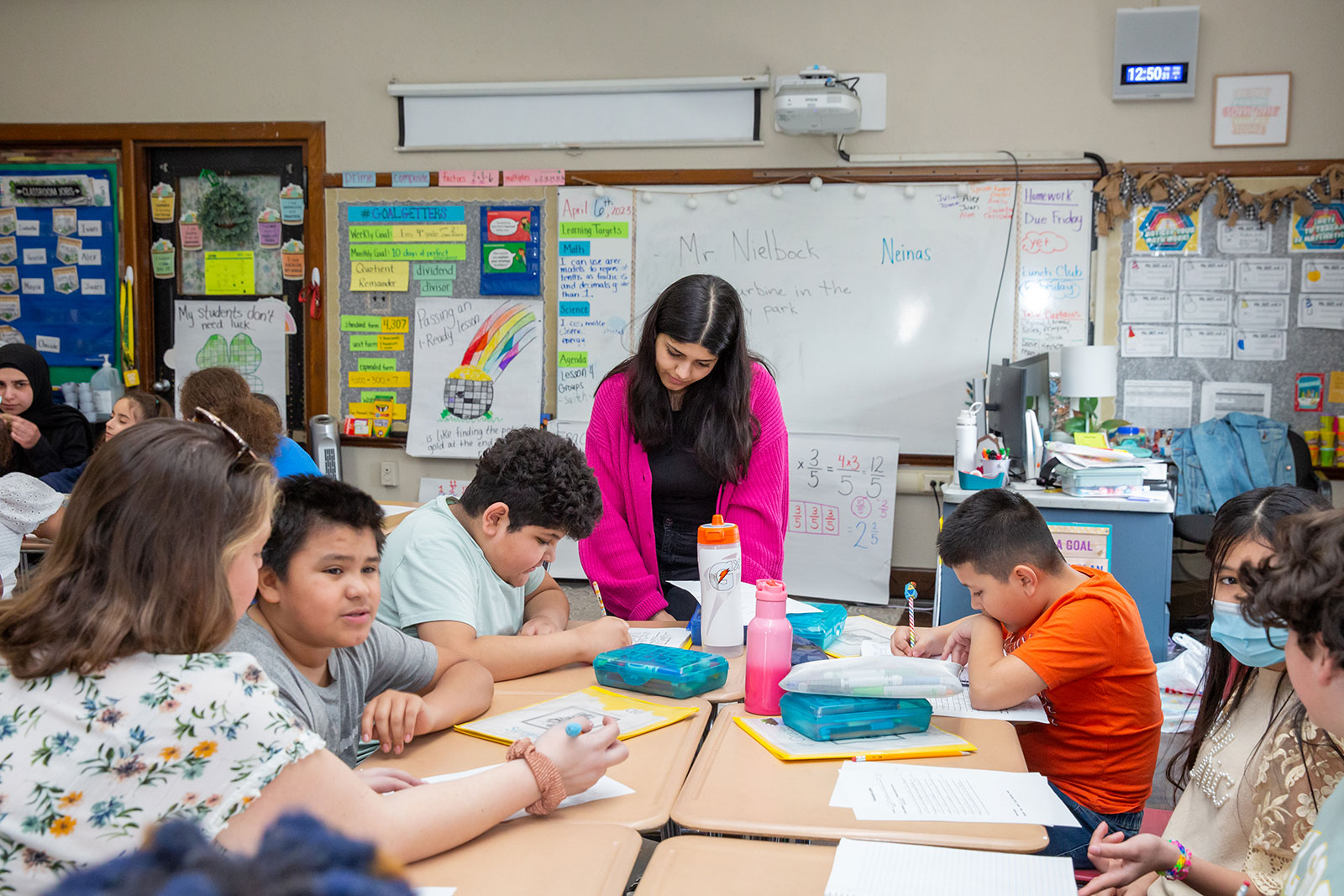 Student teacher working with students.