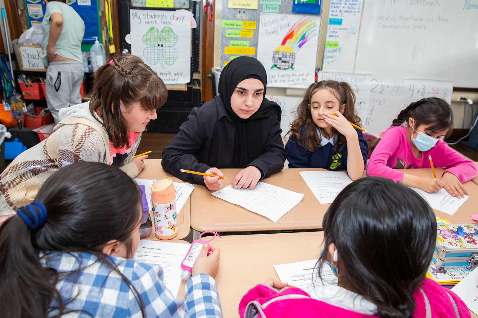 Student teacher working with students.