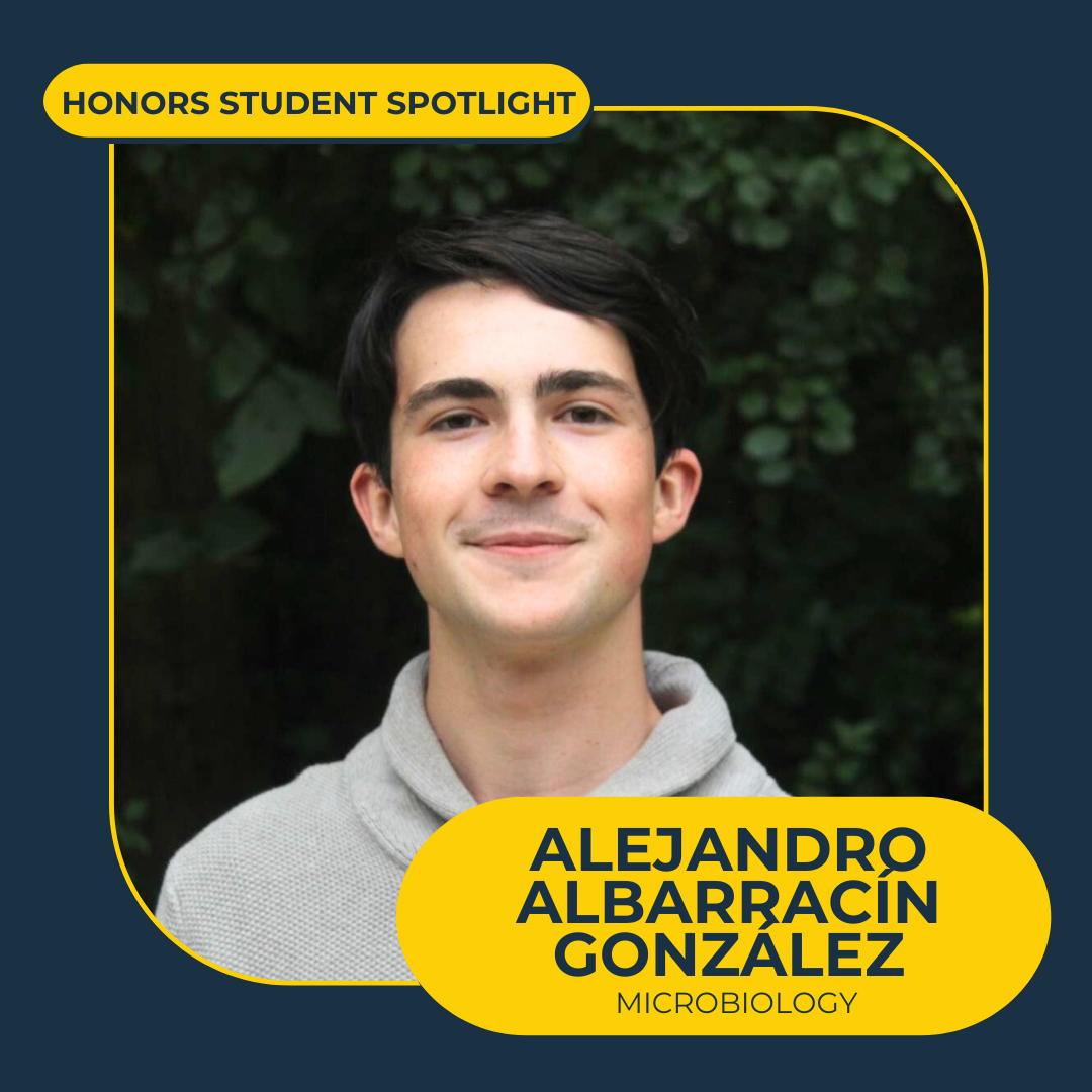 graphic with text that says "honors student spotlight, Alejandro Albarracin Gonzalez, Microbiology" that has a headshot of a man with brown hair and a grey shirt in front of dark green trees