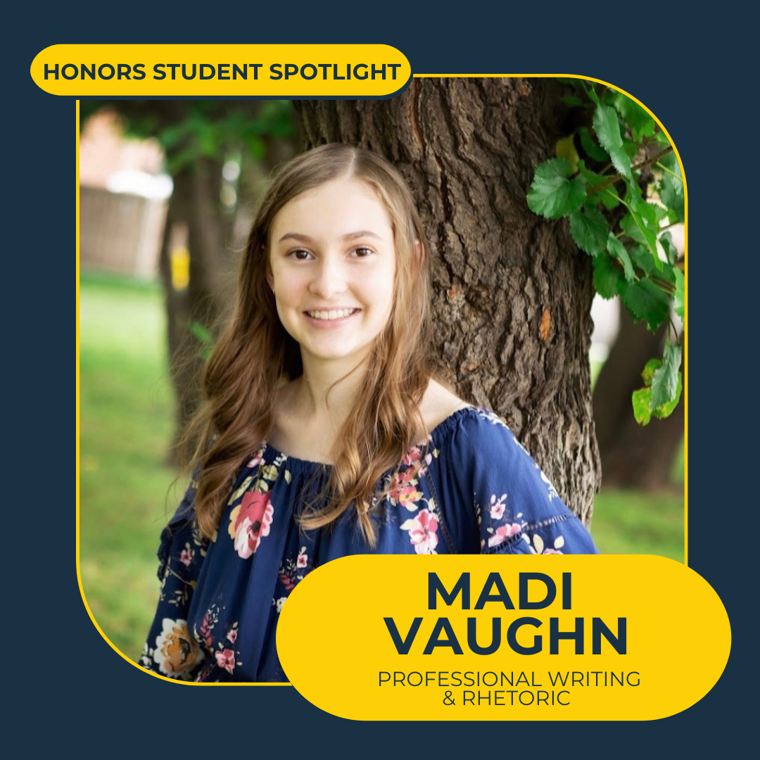 blue background with maize bubbles that says "Honors Student Spotlight, Madi Vaughn, professional writing and rhetoric" featuring a shot of a smiling person with long brownish hair in wearing a blue floral top in front of a large tree trunk with green leaves