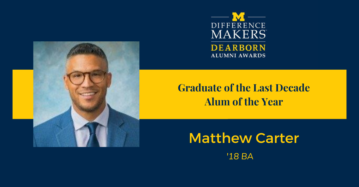 Blue background with maize ribbon that says "Grduate of the Last Decade, Alum of the Year, Matthew Carter" with a headshot of a smiling man in a blue suit and glasses