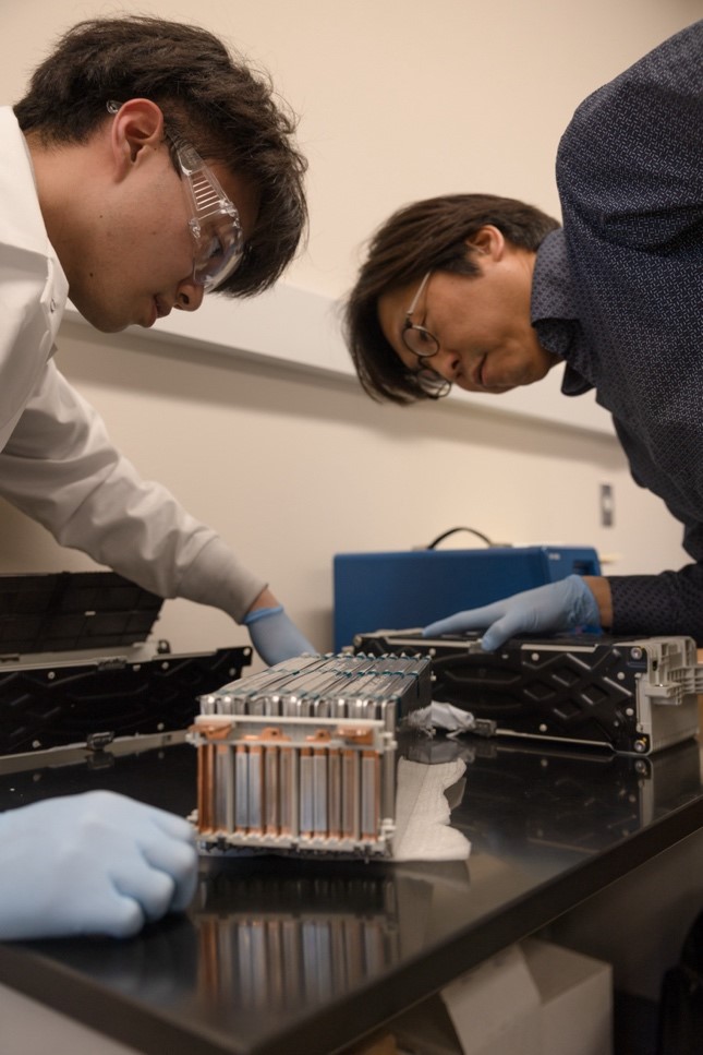 student and professor working in an engineering lab