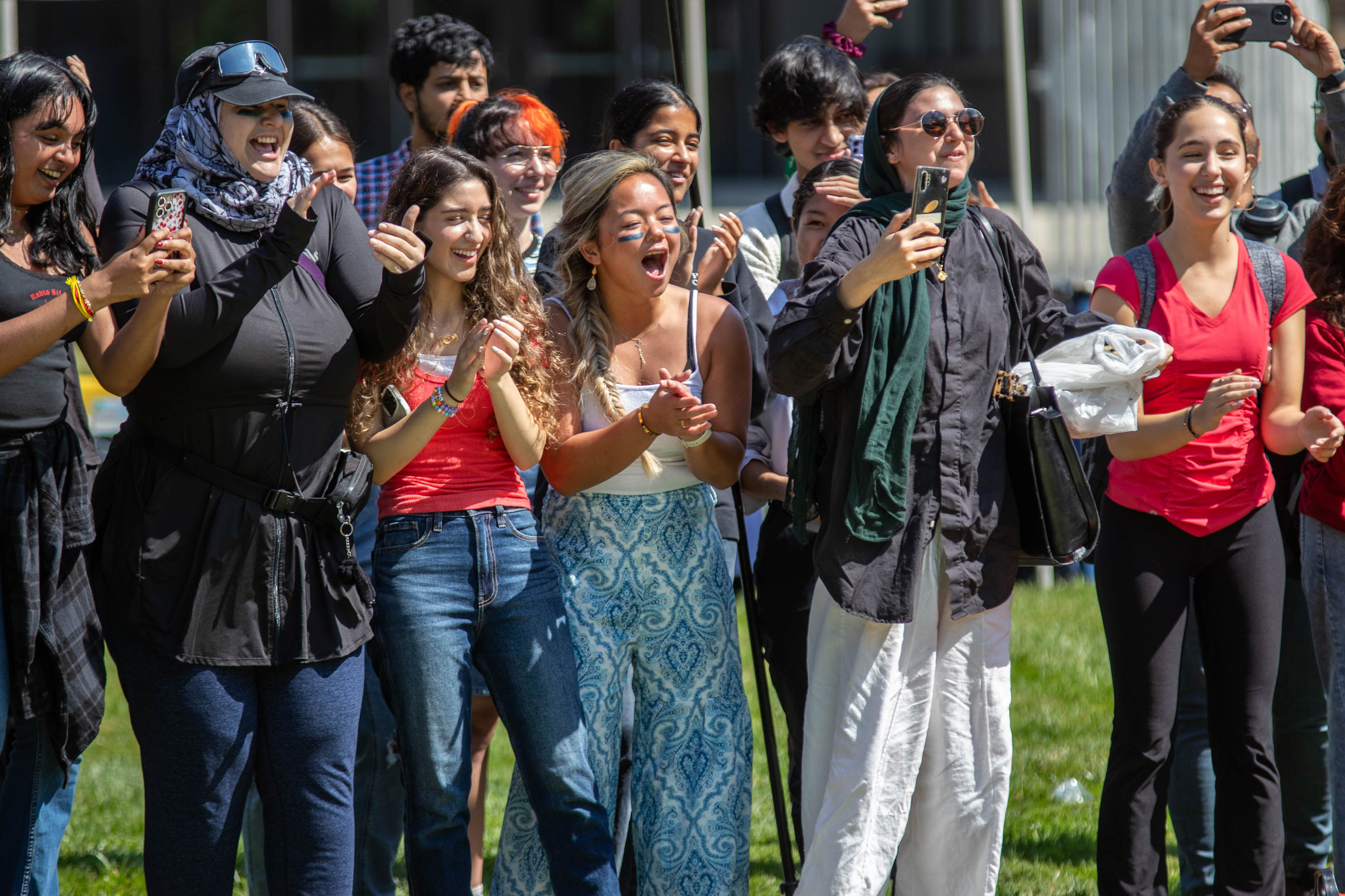 Students cheer on racers in the cardboard boat race