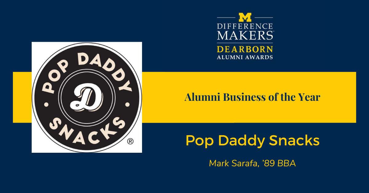 University of Michigan-Dearborn Difference Makers Alumni Awards graphic. On the left is the Pop Daddy Snacks logo, a black circle with the words 'Pop Daddy Snacks' around a stylized letter 'D' in the center. On the right, the text reads: 'Alumni Business of the Year – Pop Daddy Snacks. Mark Sarafa, ’89 BBA.