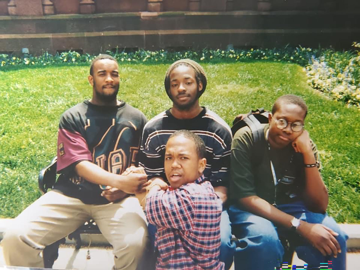 Quan and his bestfriends, when they were high school, sitting for a portrait in their neighborhood.