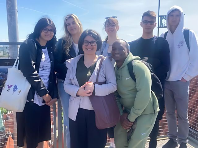 Study abroad students and professor pose in Poland