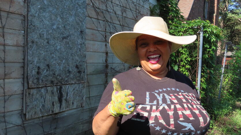 Detroit resident Anne Peeples gives encouragement during a recent alley clean-up day.